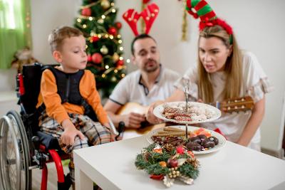 Disabled boy with man and woman