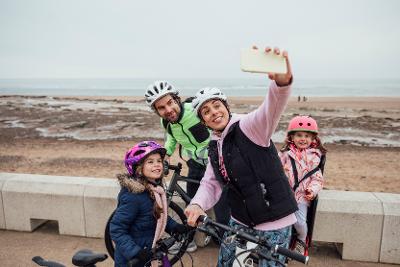 Family of four on a bike ride